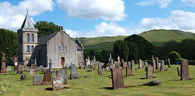 Straiton village church with the Inkerman memorial on Glengower hilltop behind